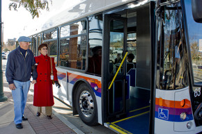 Couple boarding FLEX Express bus
