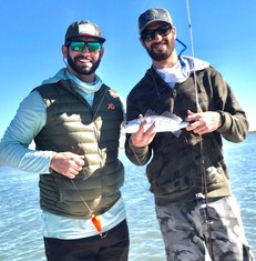 Picture of 2 men with a fish