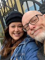 Gary DeBoer and his wife smile for the camera. 
